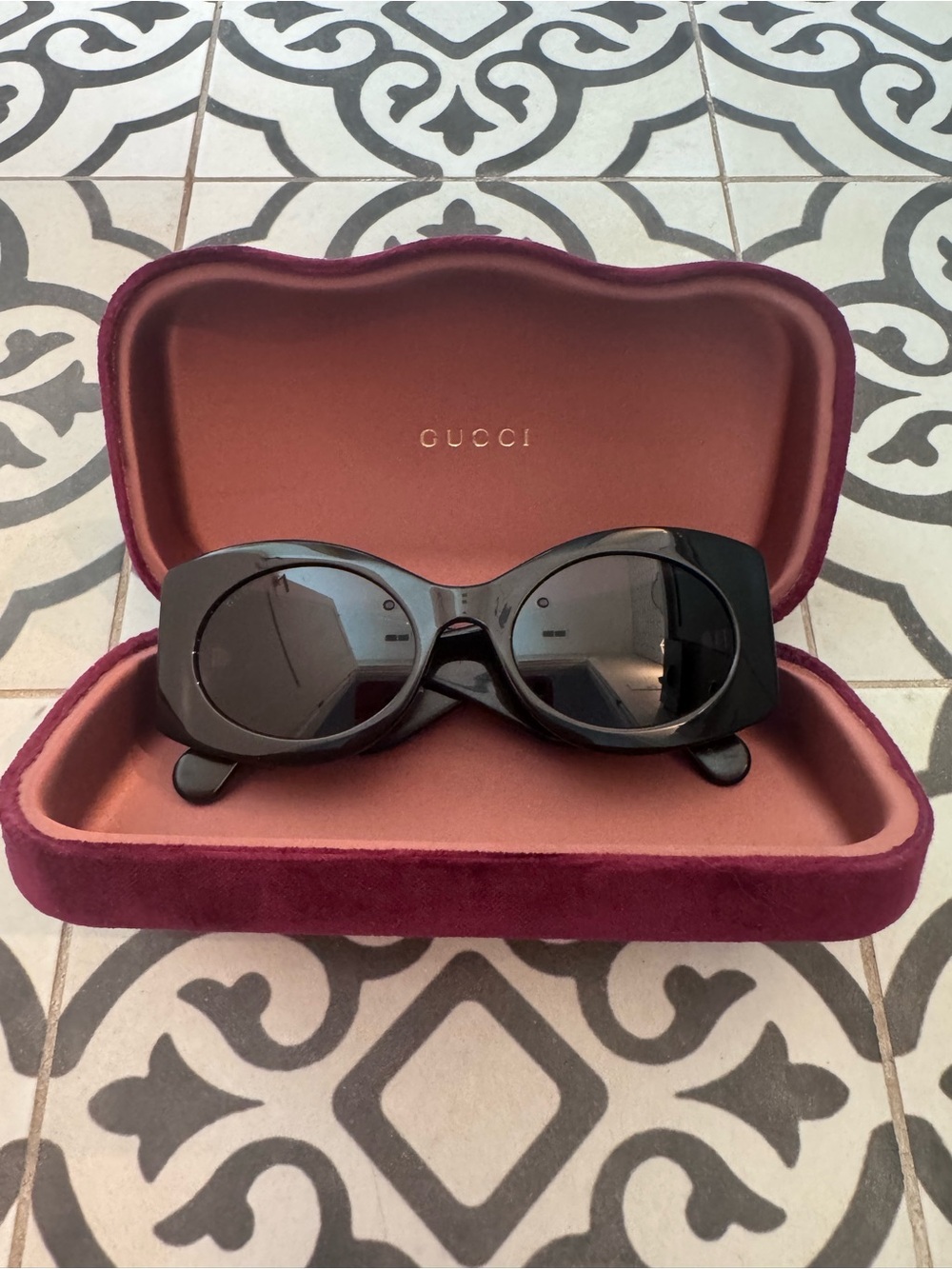 Gucci Black Oval Women's Sunglasses with Dark Lenses